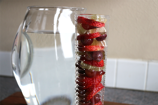Stack your infused water ingredients in a pitcher core